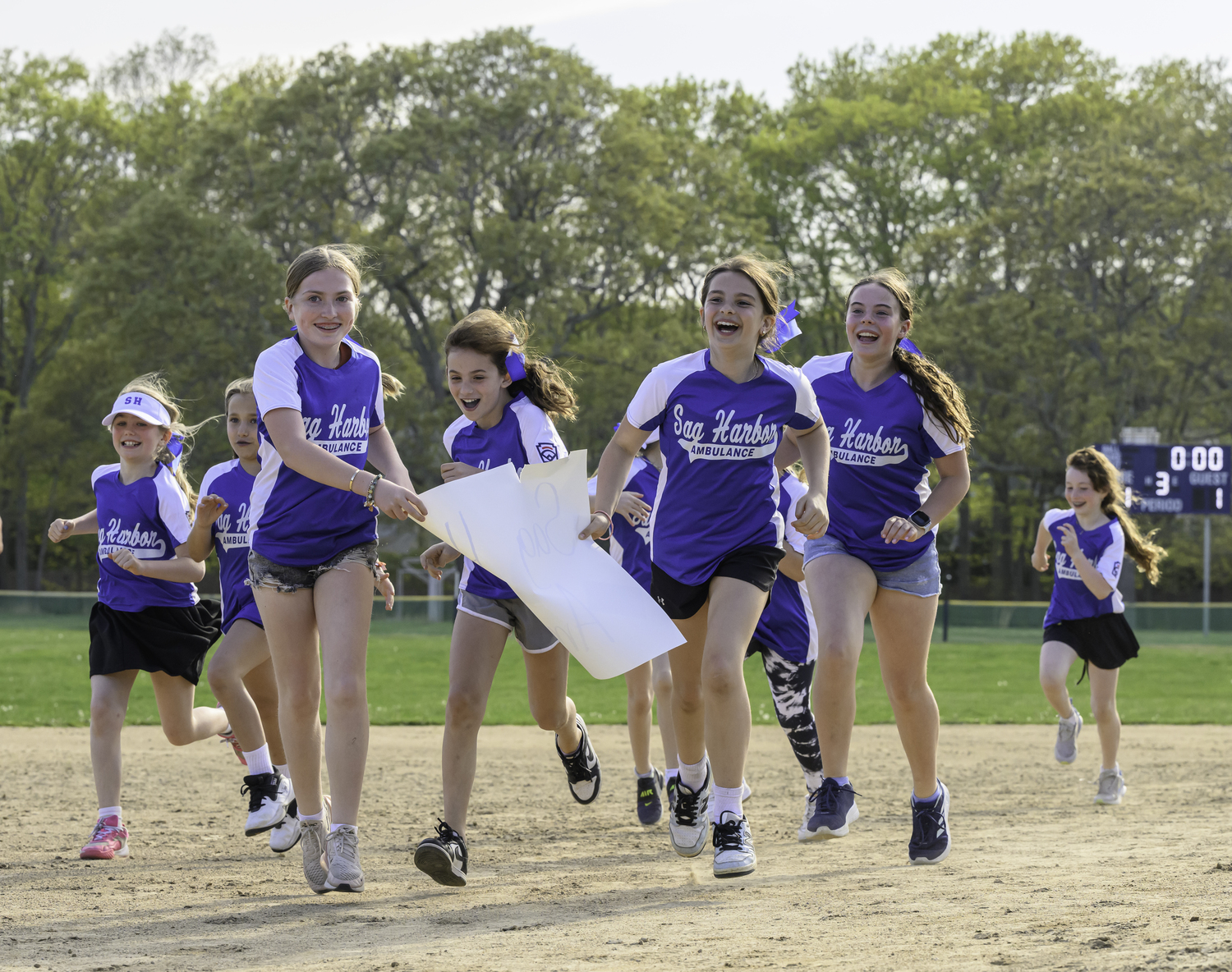 Members of the Sag Harbor Ambulance team of the Sag Harbor Little League run the bases.   MARIANNE BARNETT