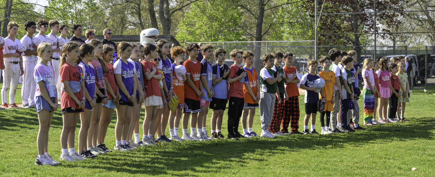 Young ballplayers of the Sag Harbor Little League since the national anthem prior to the Pierson varsity baseball game on Friday.  MARIANNE BARNETT