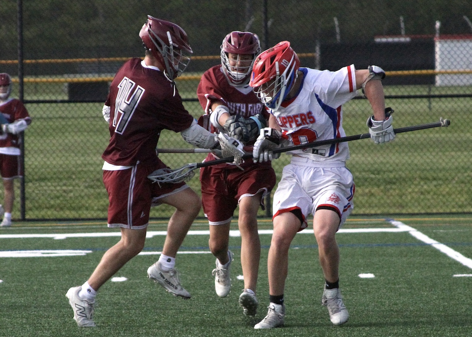 Hampton Bays sophomore Michael Single battles for a loose ball. DESIRÉE KEEGAN