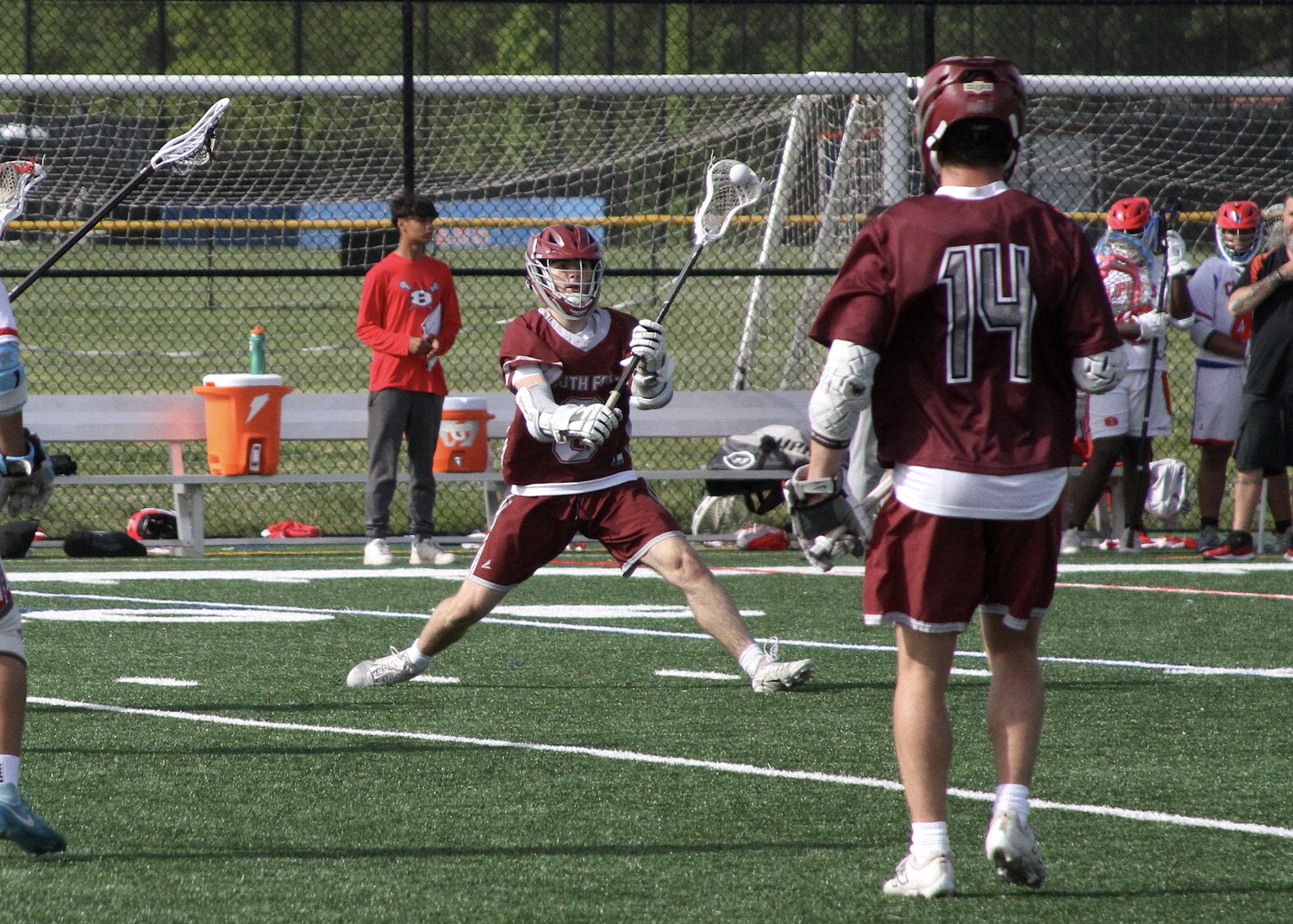 Pierson senior Slate Glick passes the ball to Hampton Bays sophomore Michael Single. DESIRÉE KEEGAN