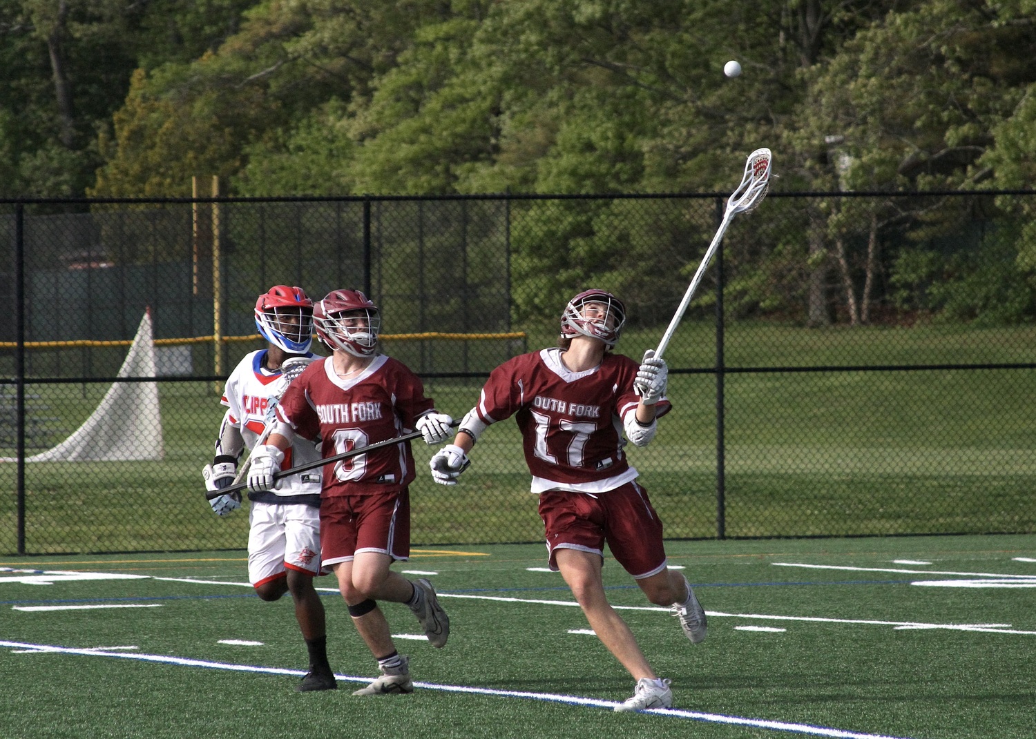 East Hampton sophomore Zane Karoussos grabs a loose ball mid-air. DESIRÉE KEEGAN