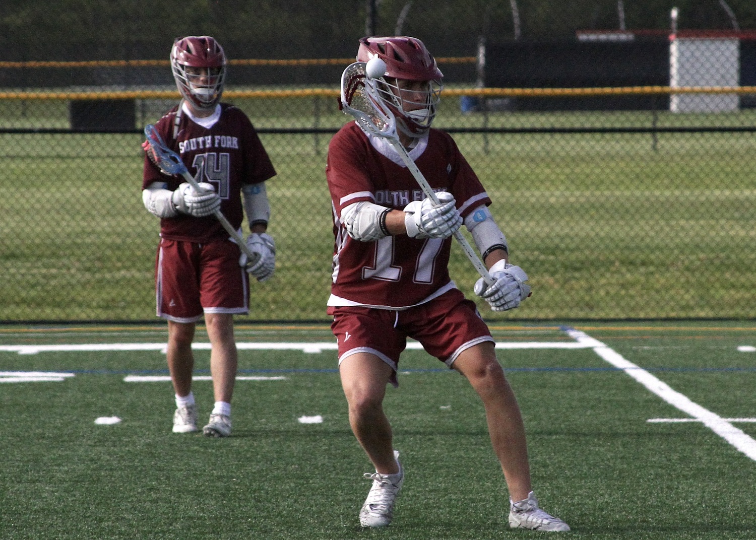 East Hampton sophomore Zane Karoussos sends the ball inside. DESIRÉE KEEGAN