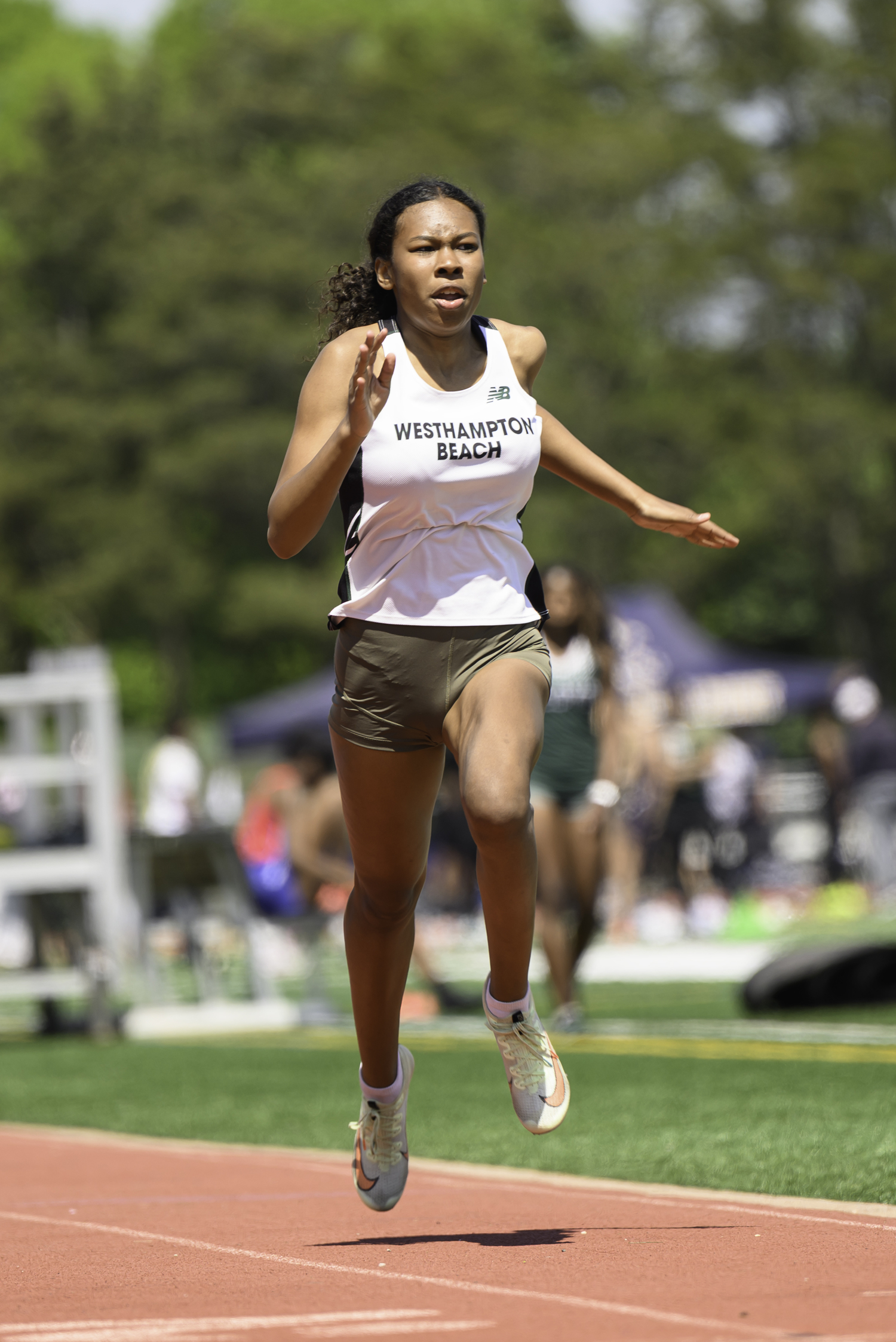 MikaiLing Pantophlet of Westhampton Beach competed in the open 100- and 200-meter dashes.  MARIANNE BARNETT