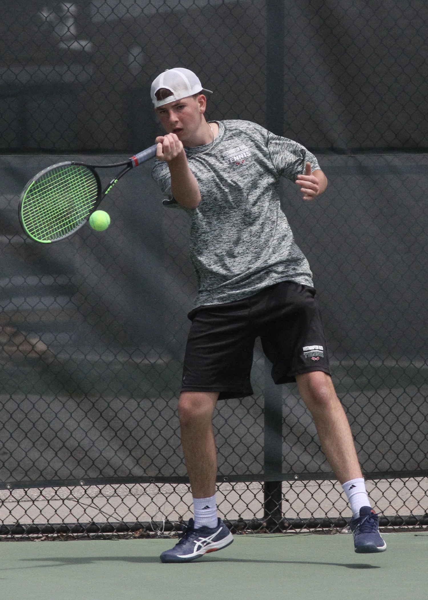 Sophomore David Meyers returns the ball. DESIRÉE KEEGAN