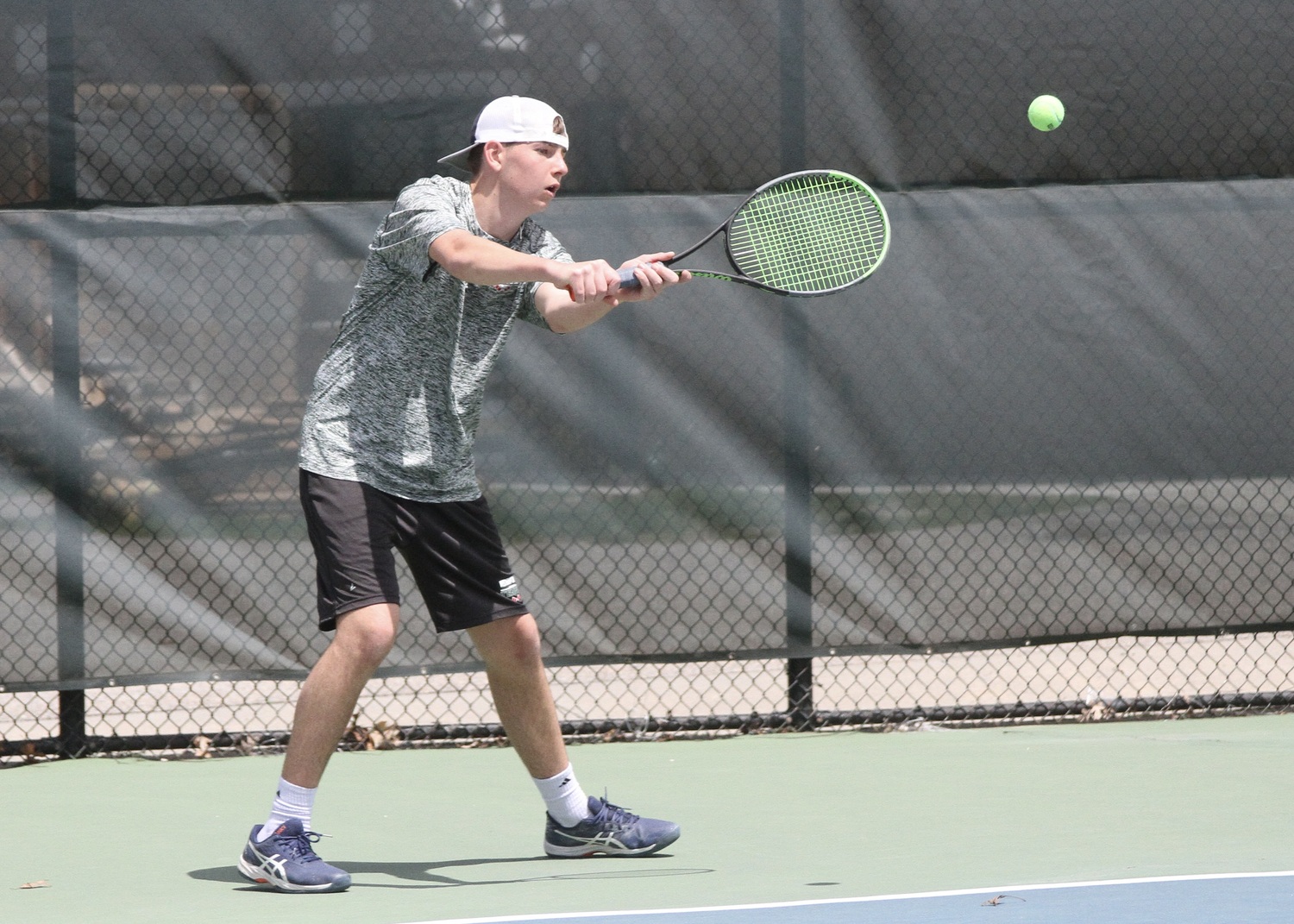 Sophomore David Meyers swings his forehand. DESIRÉE KEEGAN