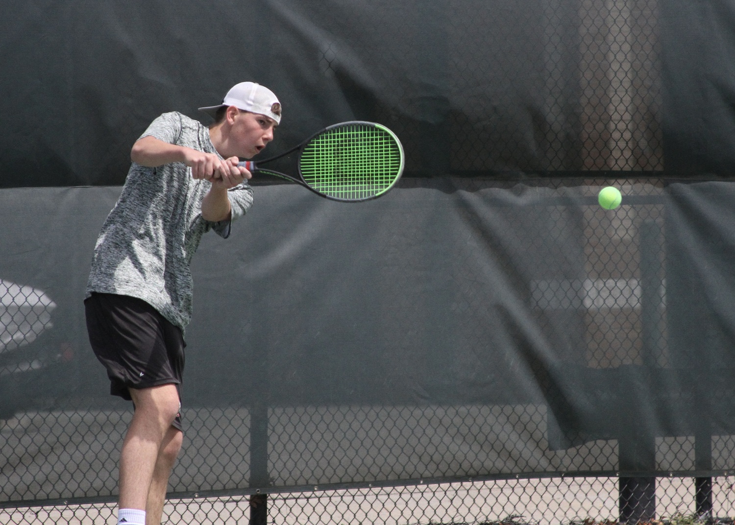 Sophomore David Meyers sends the ball back over the net. DESIRÉE KEEGAN