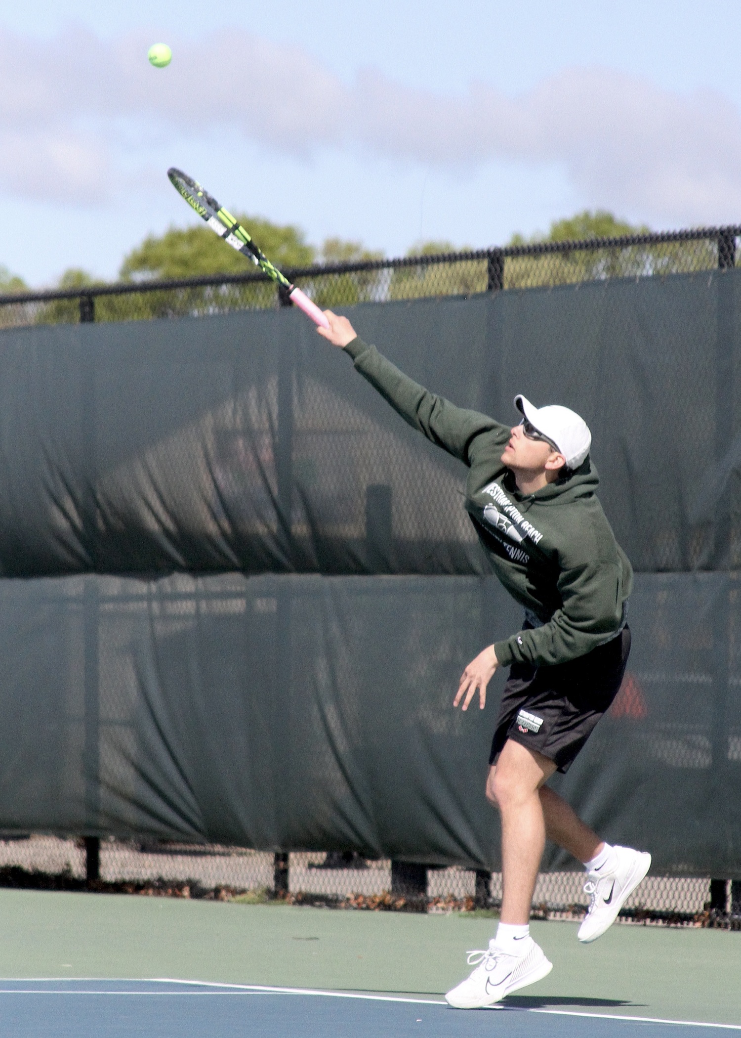 Senior Giancarlo Volpe serves. DESIRÉE KEEGAN