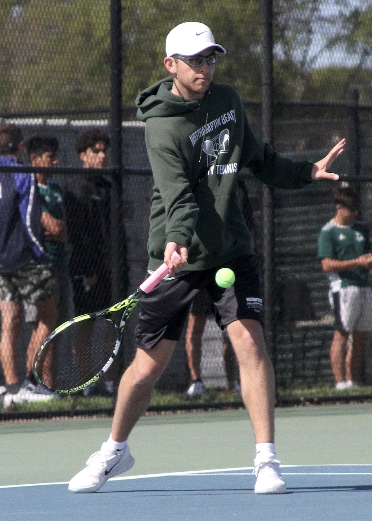 Senior Giancarlo Volpe returns a serve. DESIRÉE KEEGAN