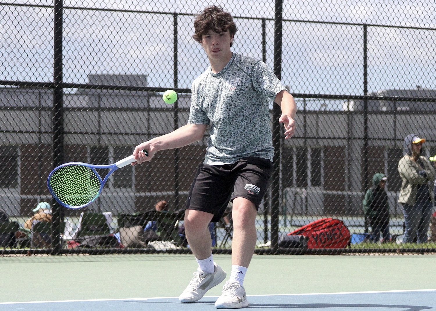 Freshman Ian Besser waits to swing. DESIRÉE KEEGAN