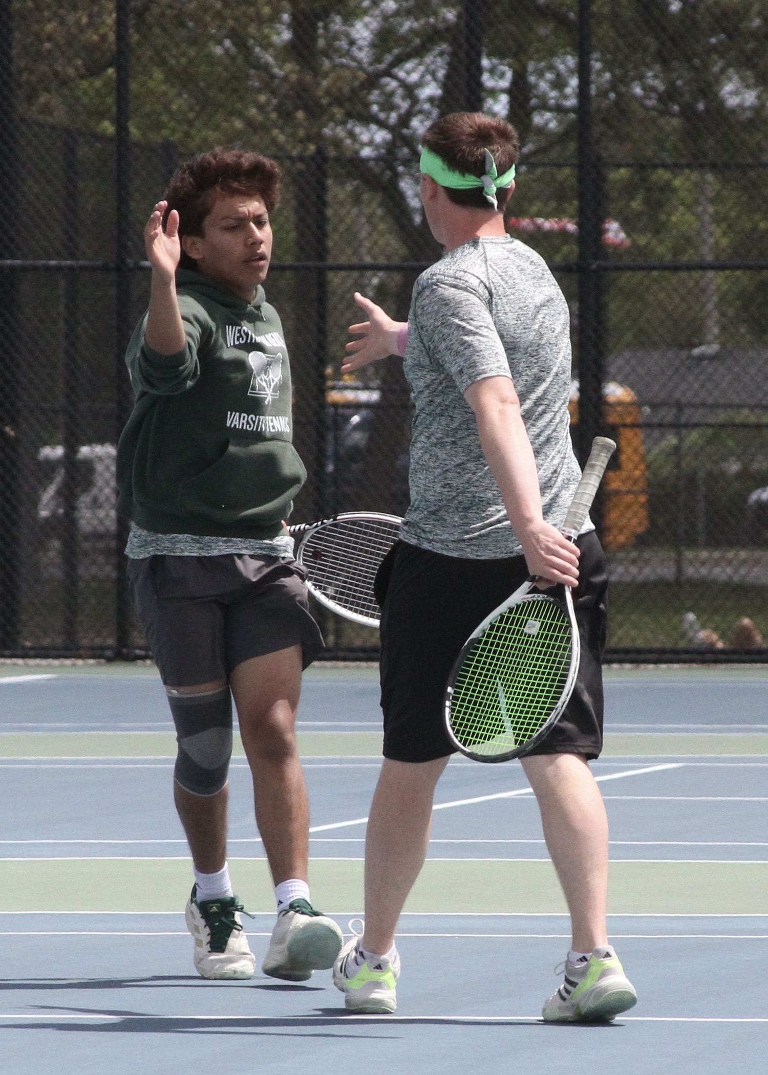 Sophomore Manny Gomez and senior Matt Moran celebrate a point. DESIRÉE KEEGAN