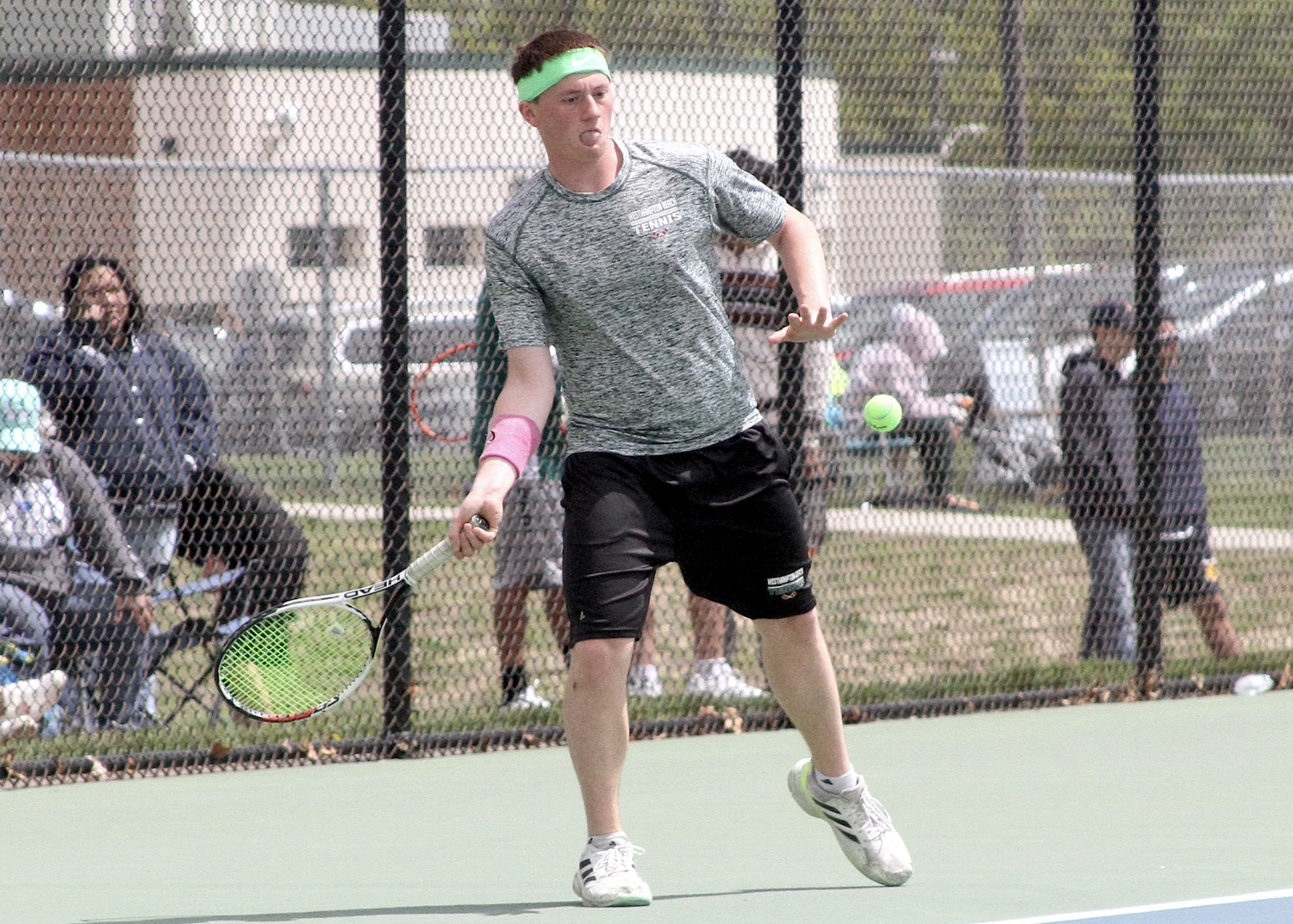 Senior Matt Moran returns a serve. DESIRÉE KEEGAN