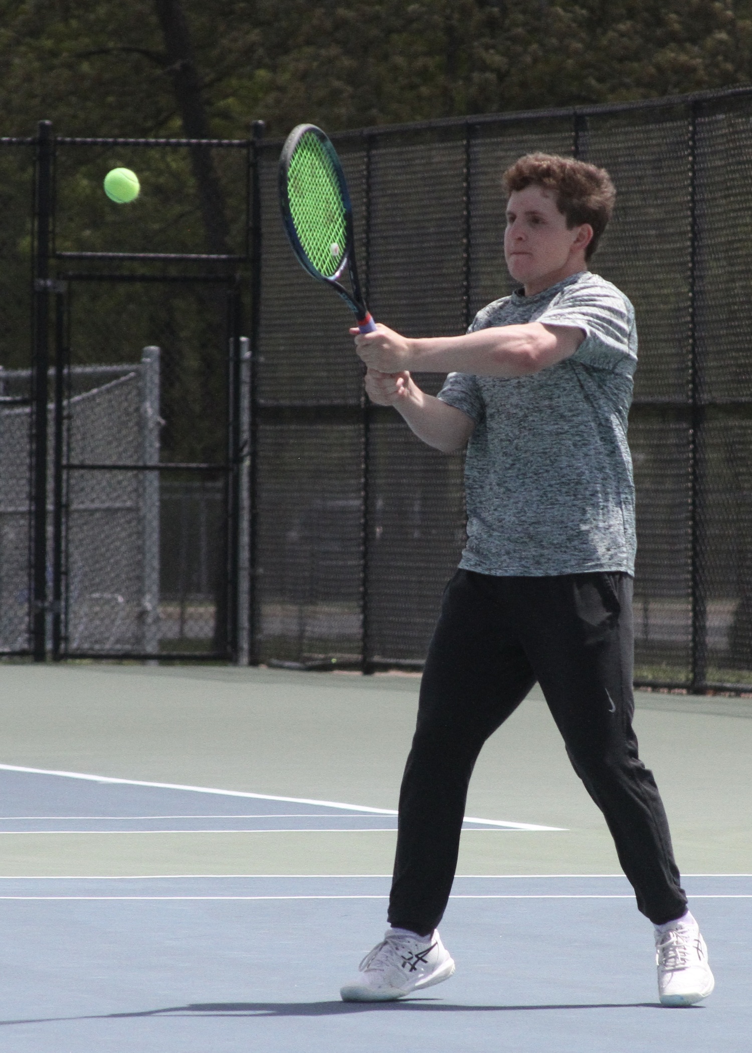 Junior Robby Schumacher returns a serve. DESIRÉE KEEGAN