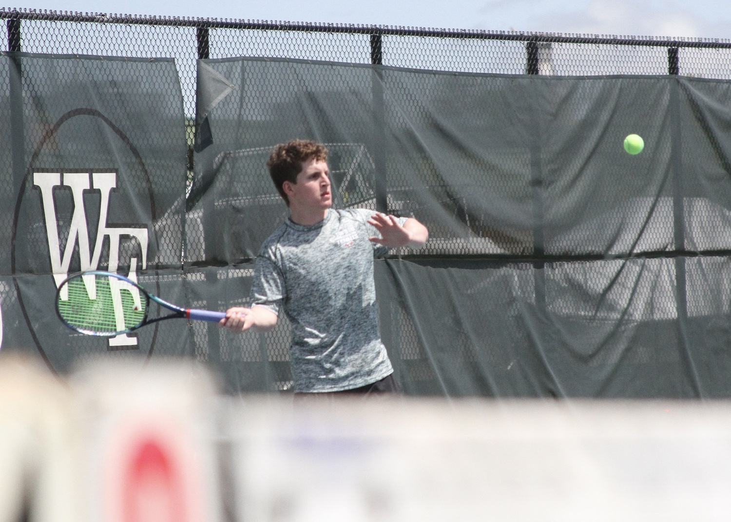 Junior Robby Schumacher sends the ball over the net. DESIRÉE KEEGAN