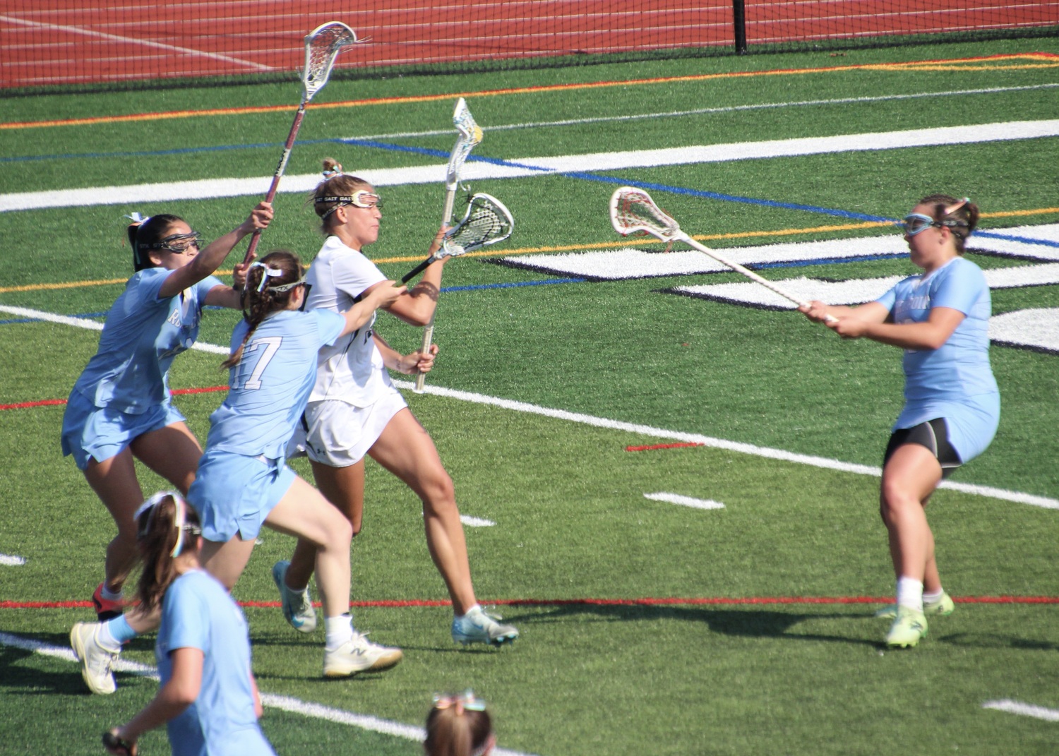 Senior midfielder Reese King moves to the cage. MARY BEASLEY