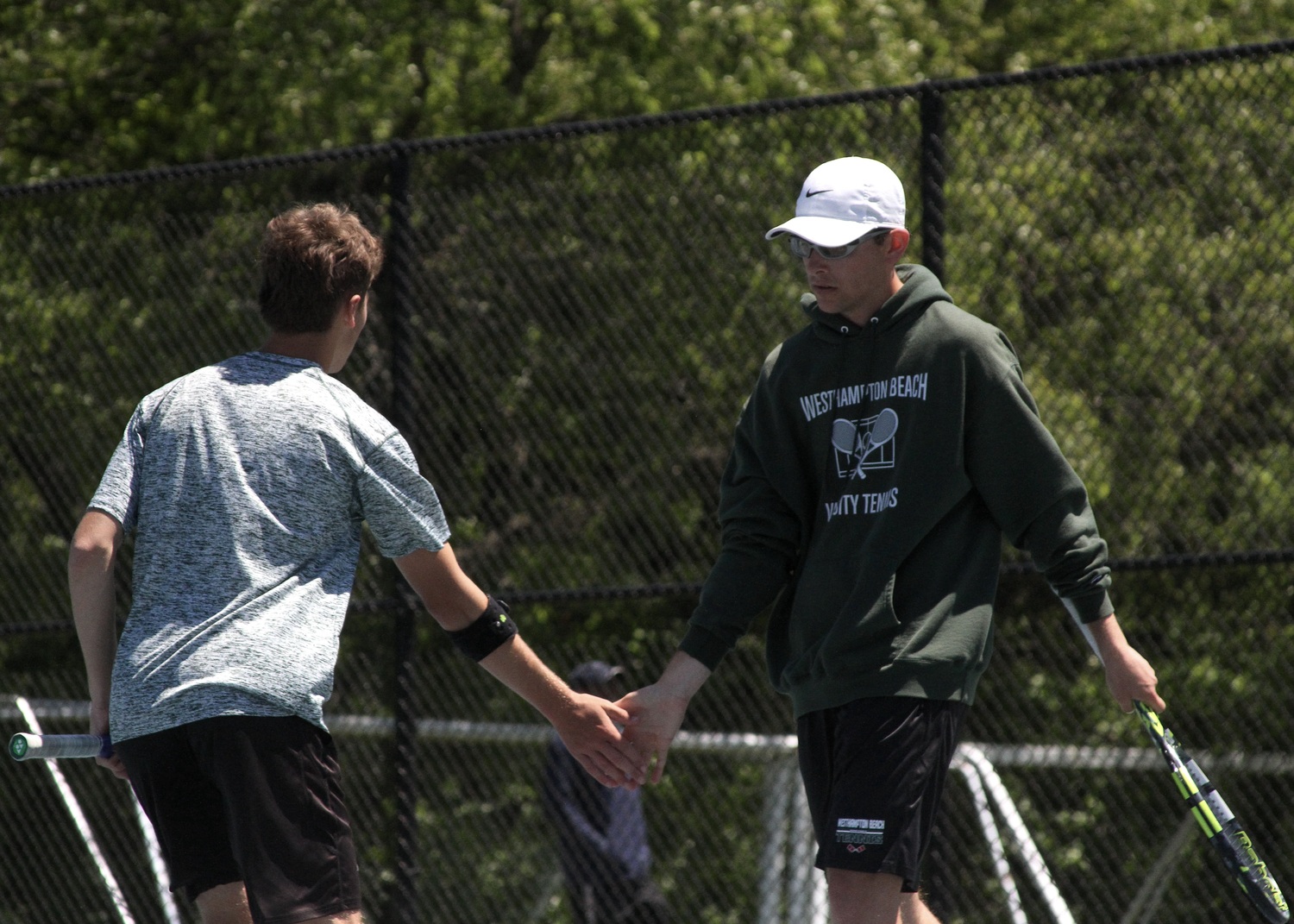 Junior Bryce Groth and senior Giancarlo Volpe celebrate a point. DESIRÉE KEEGAN