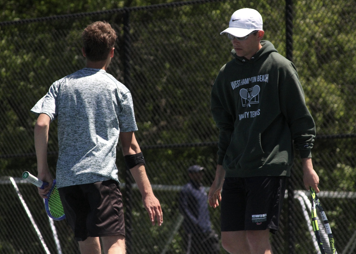 Junior Bryce Groth and senior Giancarlo Volpe come together after a point. DESIRÉE KEEGAN