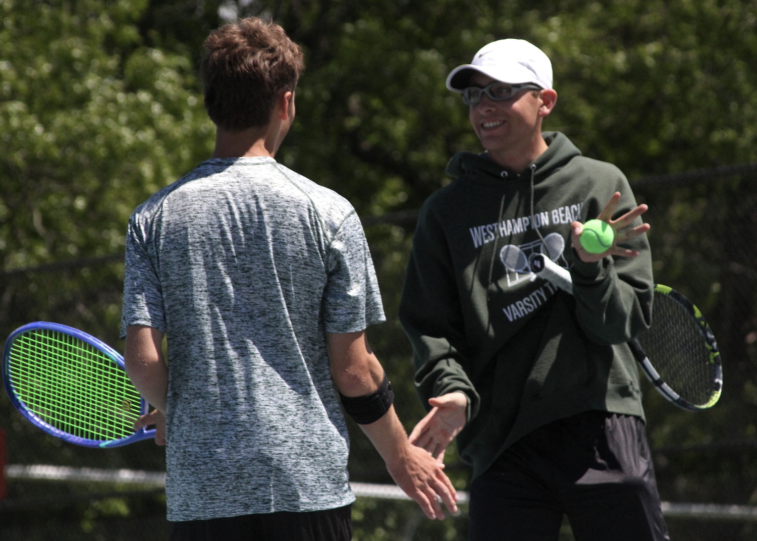 Junior Bryce Groth and senior Giancarlo Volpe celebrate a point. DESIRÉE KEEGAN