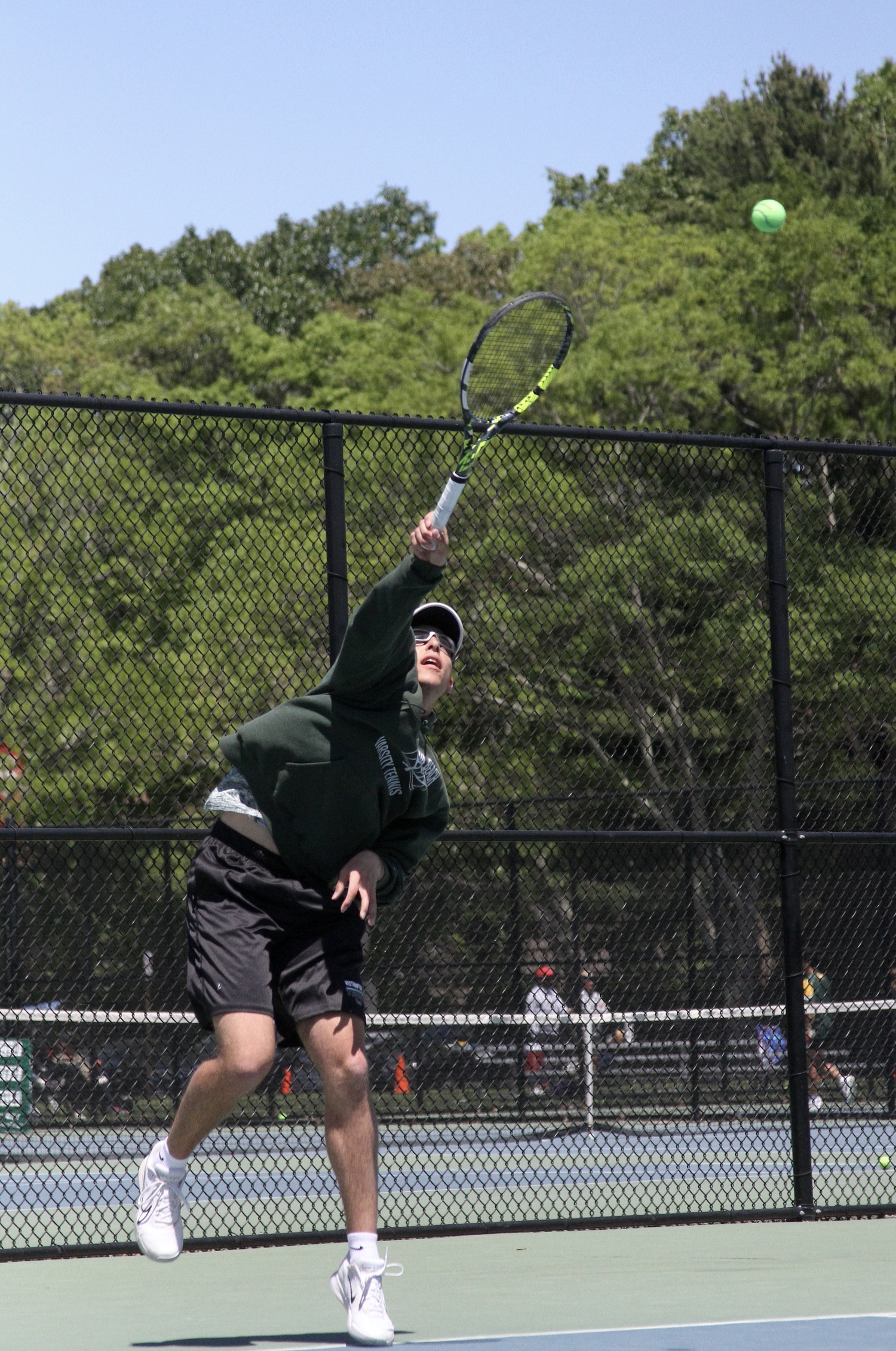 Senior Giancarlo Volpe serves. DESIRÉE KEEGAN