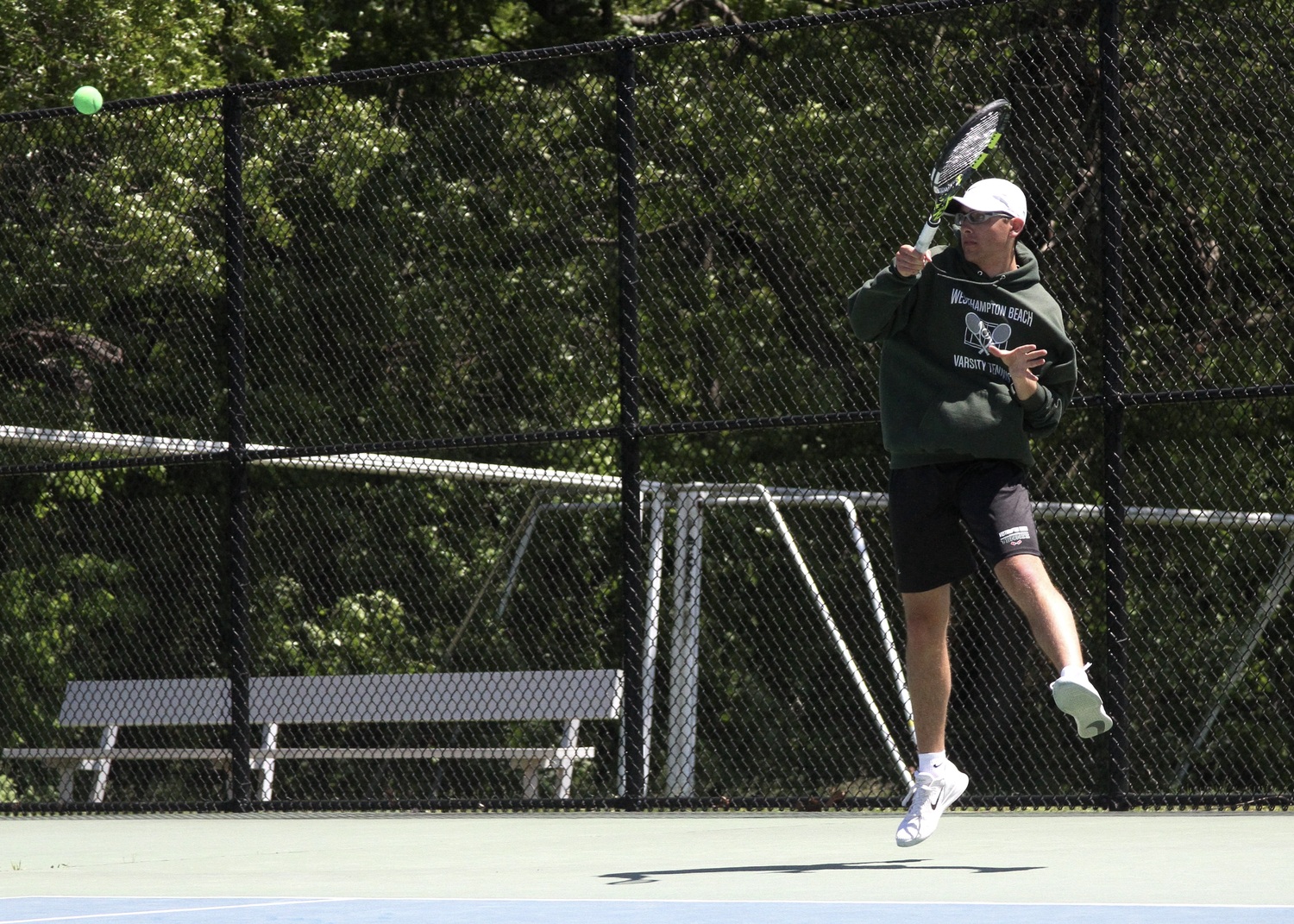 Senior Giancarlo Volpe returns a serve. DESIRÉE KEEGAN