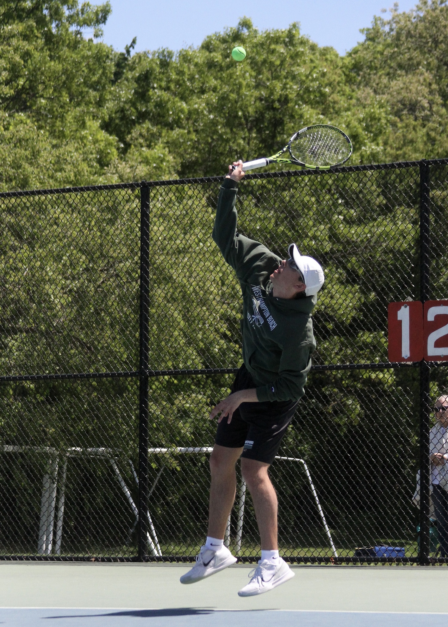 Senior Giancarlo Volpe serves. DESIRÉE KEEGAN