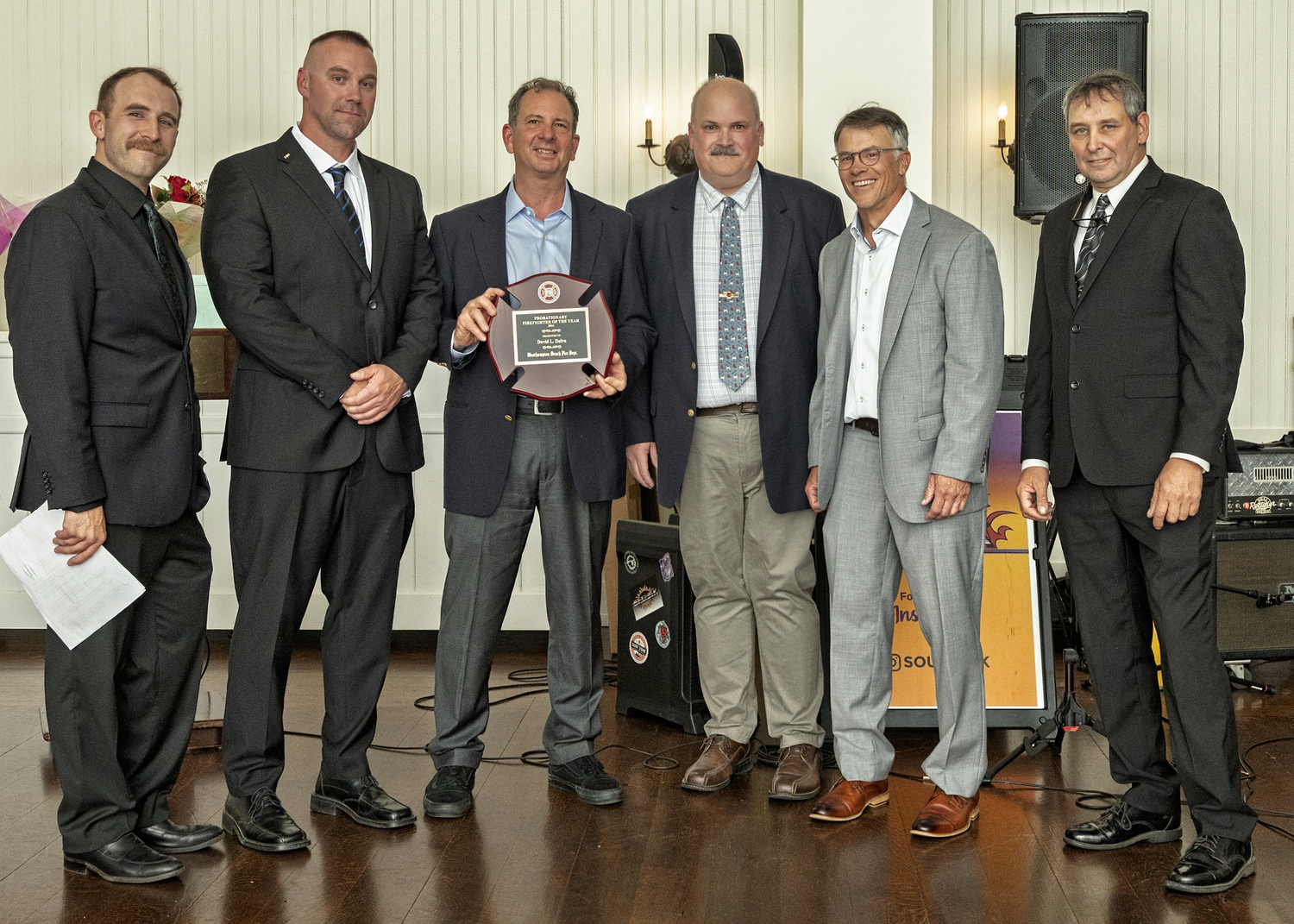 Firefighter David Davila (holding plaque) was honored as the Probationary Firefighter of the Year. From left, First Assistant Chief Jeff Wachenfeld, Third Assistant Chief Joey Gordon, Ex-chief Darryl Schunk, Lieutenant Dan Pulick, and Chief Larry Saccente. COURTESY WESTHAMPTON BEACH FIRE DEPARTMENT