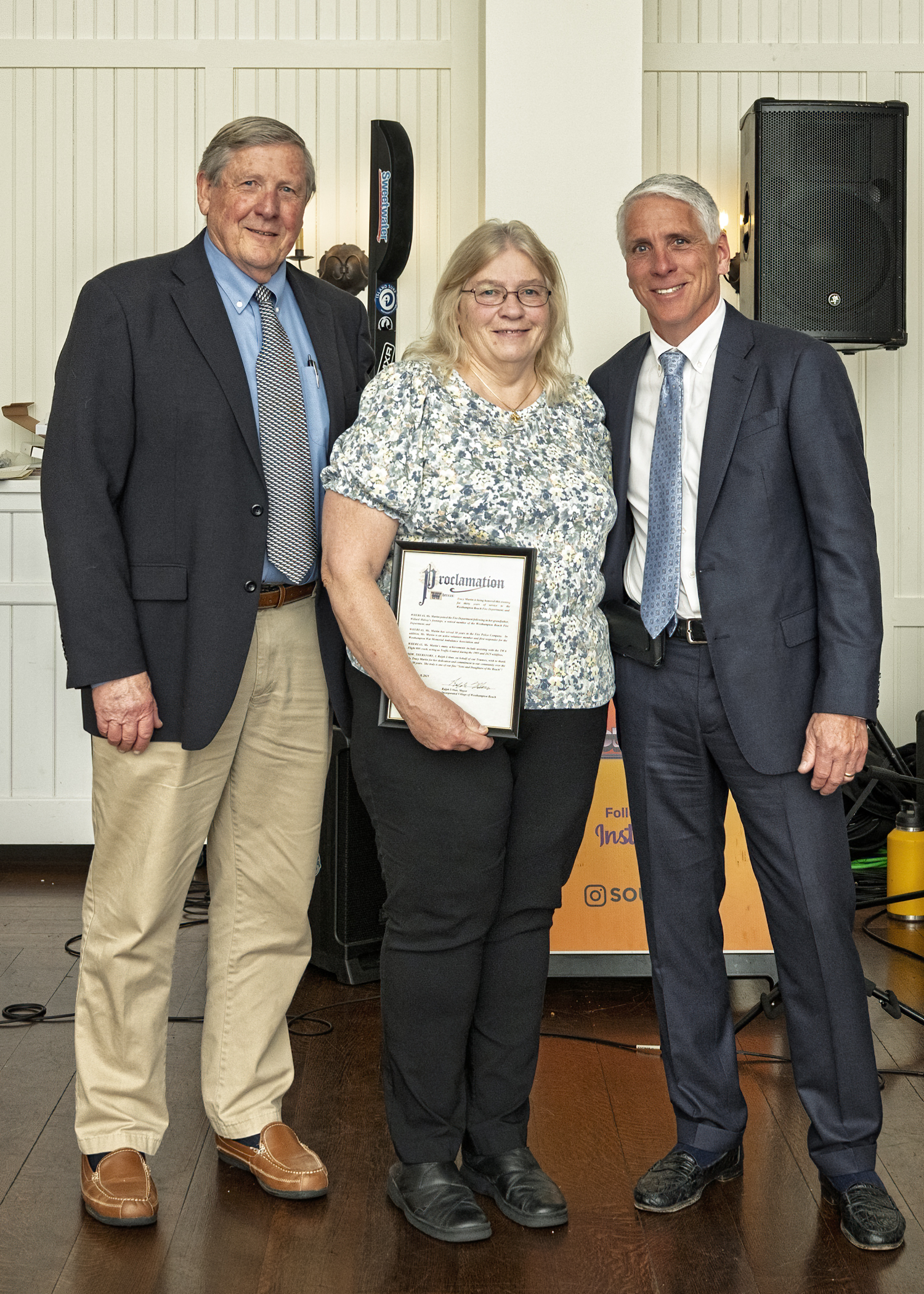 Special honoree Tracy Martin, center, received a proclamation from the Village of Westhampton Beach, presented by Mayor Ralph Urban (left) and village trustee Rob Rubio. COURTESY WESTHAMTPON BEACH FIRE DEPARTMENT