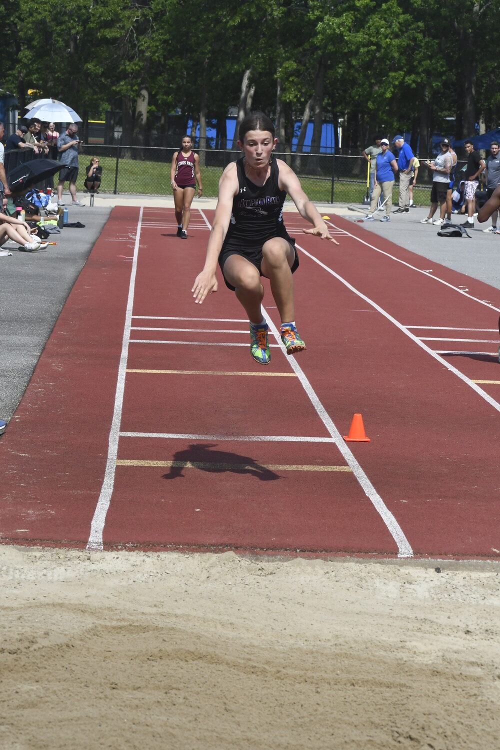 Hampton Bays freshman Eleanor Ramsey in the long jump.  DREW BUDD