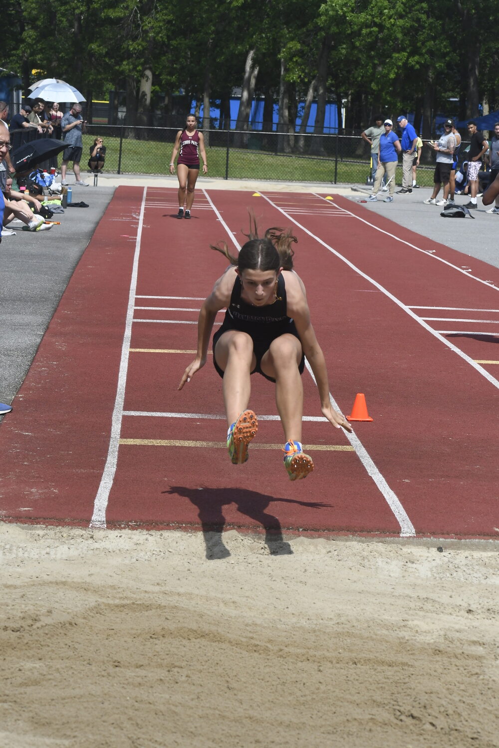Hampton Bays freshman Eleanor Ramsey in the long jump.  DREW BUDD