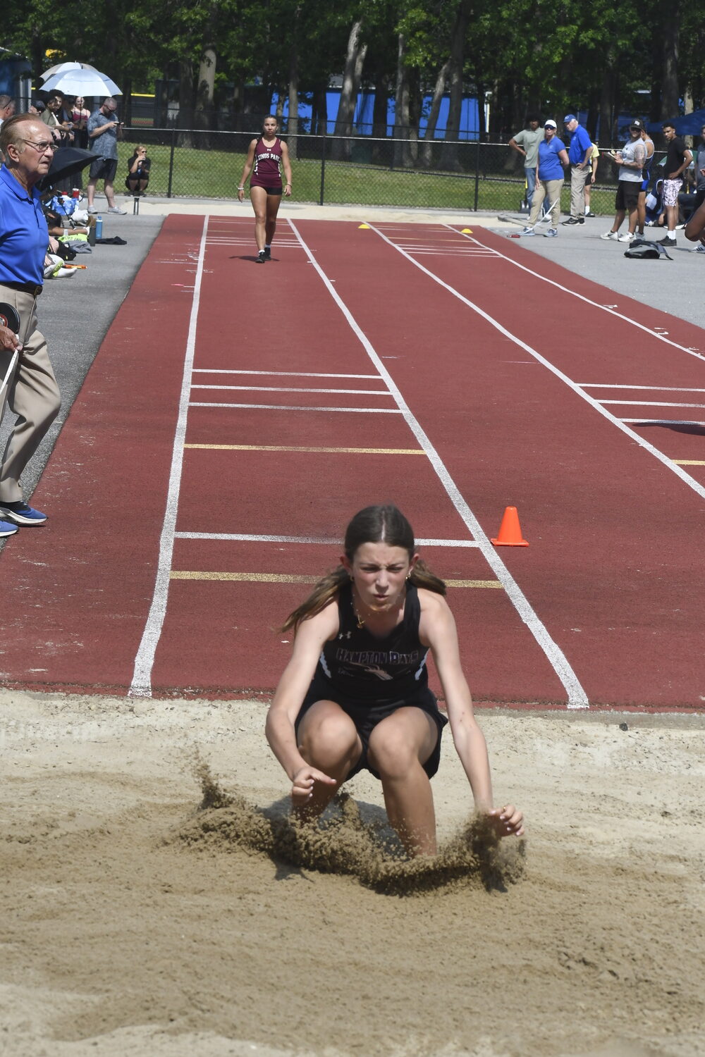 Hampton Bays freshman Eleanor Ramsey in the long jump.  DREW BUDD