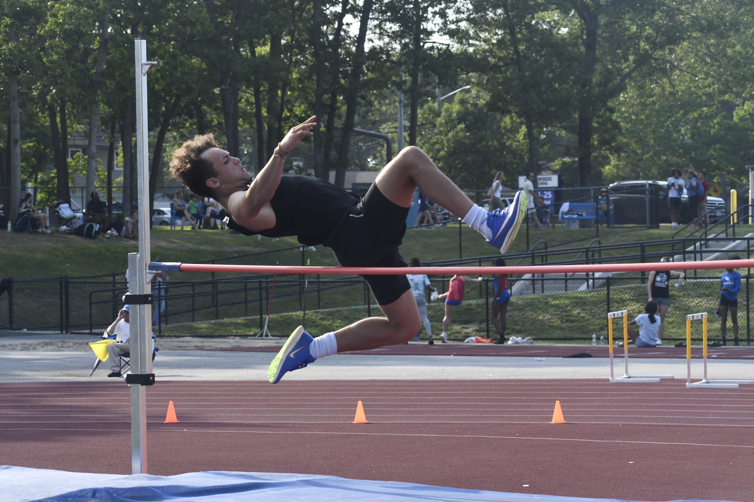 Westhampton Beach senior Ezekiel McCrary in the high jump of the pentathlon.  DREW BUDD
