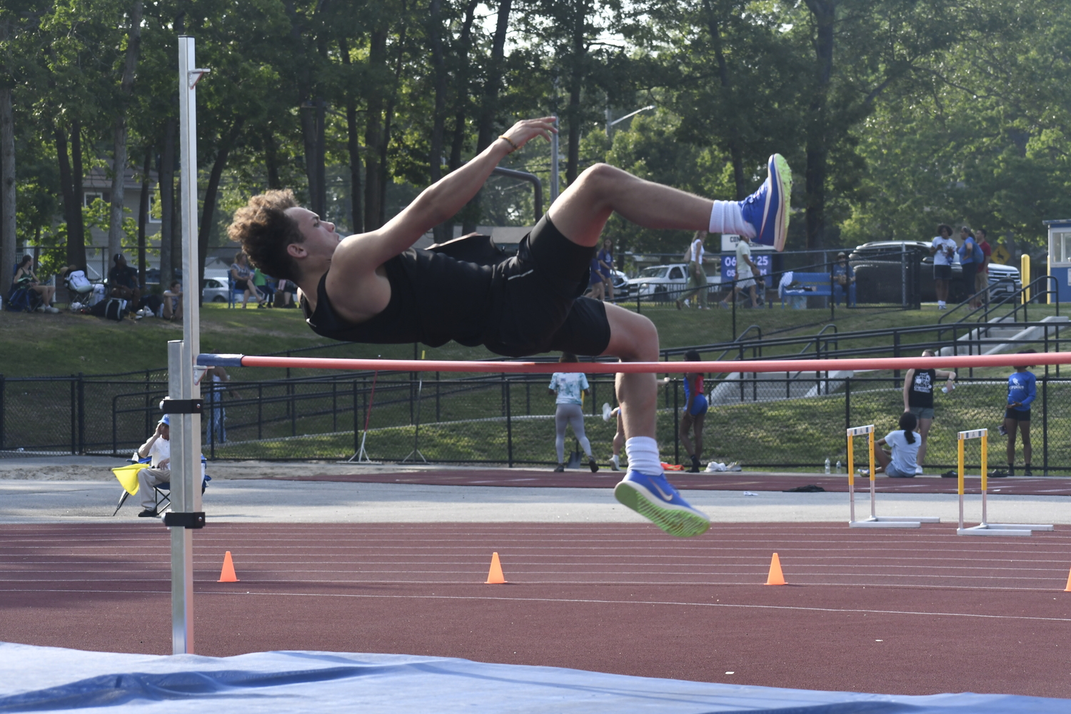 Westhampton Beach senior Ezekiel McCrary in the high jump of the pentathlon.  DREW BUDD