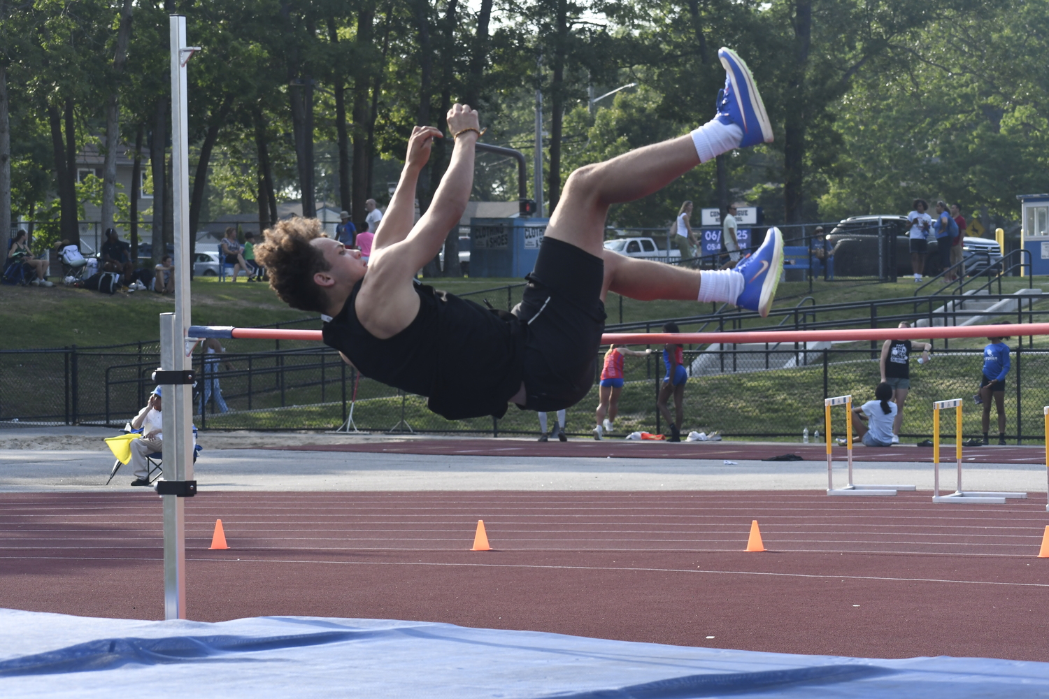 Westhampton Beach senior Ezekiel McCrary in the high jump of the pentathlon.  DREW BUDD