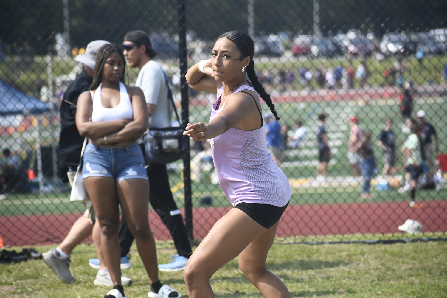 Hampton Bays senior Asha Pensa-Johnson starts her motion in the shot put.  DREW BUDD