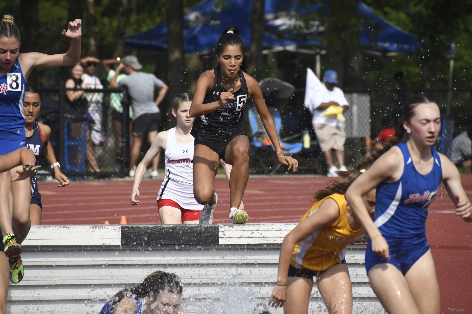 Hampton Bays senior Sofia Galvan in the 2,000-meter steeplechase.  DREW BUDD