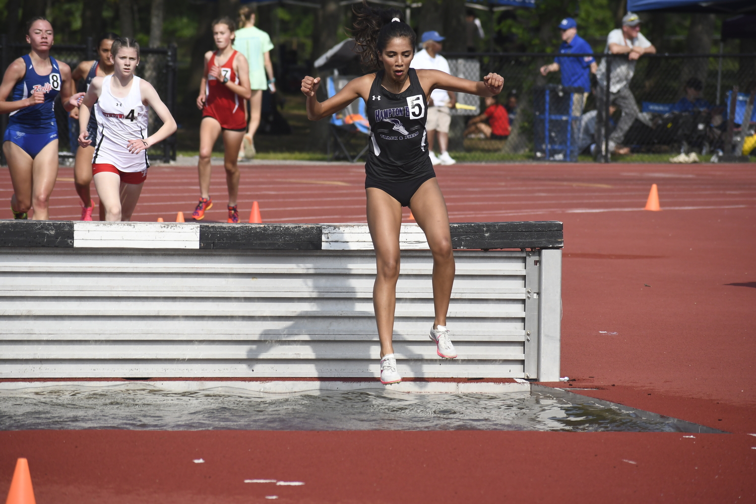 Hampton Bays senior Sofia Galvan in the 2,000-meter steeplechase.  DREW BUDD