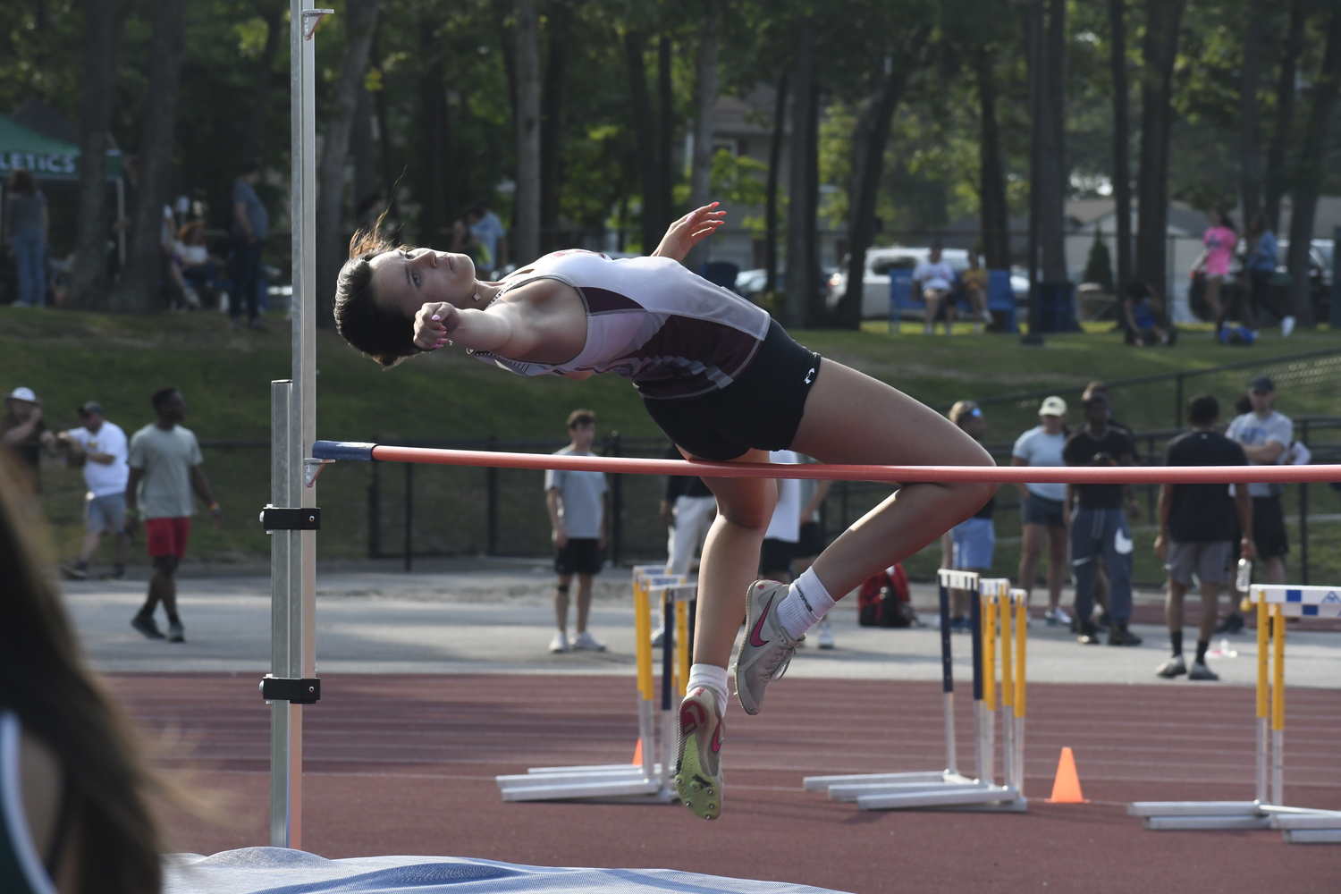 East Hampton senior Alex Kohloff in the high jump.  DREW BUDD