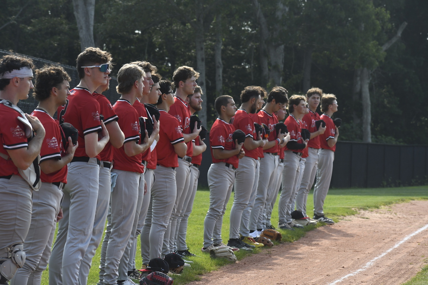 The Westhampton Aviators line up for the national anthem in the Hamptons Collegiate Baseball League season opener on Thursday, June 12.  DREW BUDD