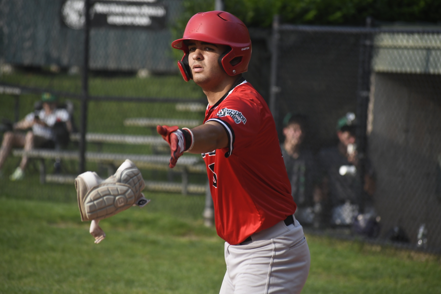 Drew McGowan (Marist) tosses his gear after drawing the third consecutive walk in the inning for the Aviators, which eventually led to their first and only run of last week's season opener.  DREW BUDD