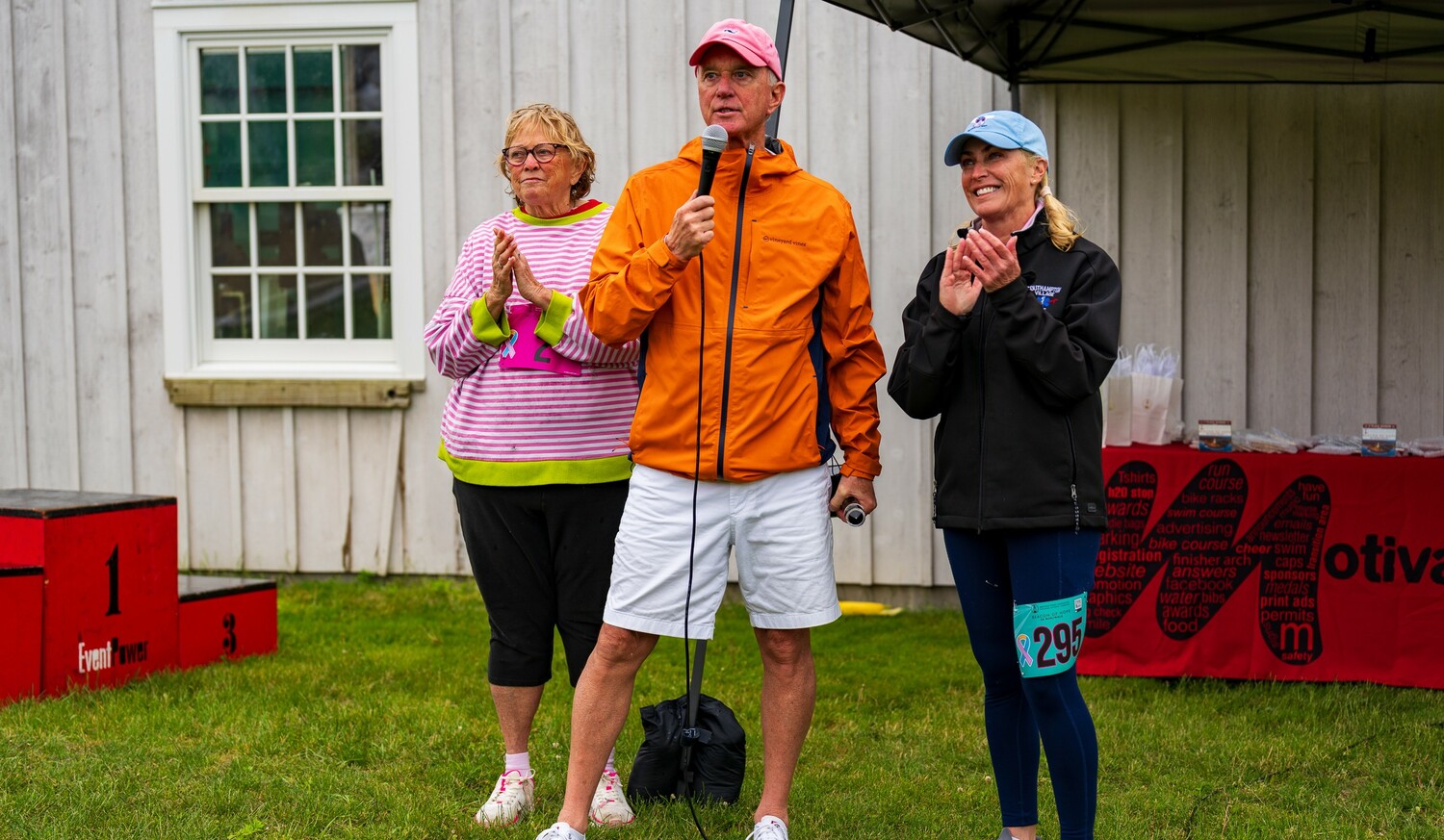 Montauk Lighthouse keeper Joe Gaviola, flanked by Susie Roden to his right and Stacy Quarty, was this year's honoree.  ENDURANCE SPORTS PHOTOGRAPHY