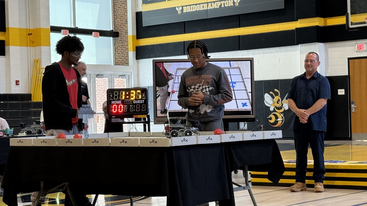 Bridgehampton School students Jordan Harding and Christian Pinckney with teacher Mr. Giosi at the VEX Robotics Competition. COURTESY BRIDGEHAMPTON SCHOOL DISTRICT