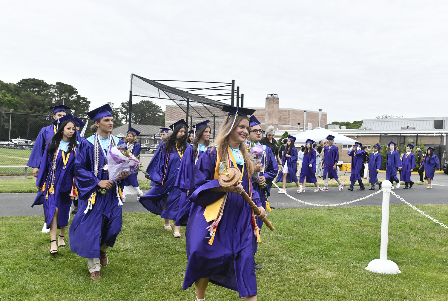 The Hampton Bays High School Class of 2025 enters the tent.  DANA SHAW