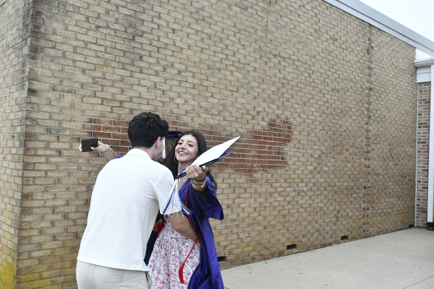 Members of the class or 2025 celebrate with friends and family after graduation.  DANA SHAW