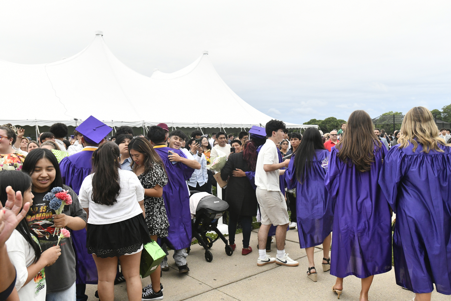 Members of the class or 2025 celebrate with friends and family after graduation.  DANA SHAW