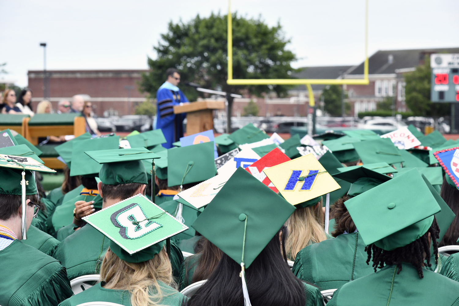 Westhampton Beach High School Principal Christopher Herr welcomes the crowd to the commencement ceremony on June 27.  DANA SHAW
