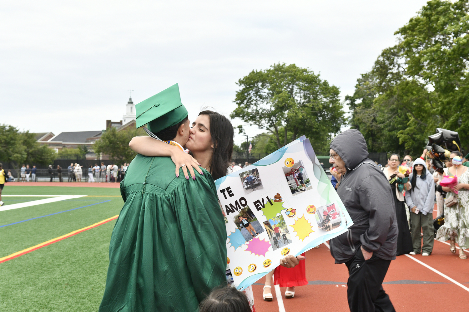 Graduates and their families celebrate after the ceremony.  DANA SHAW