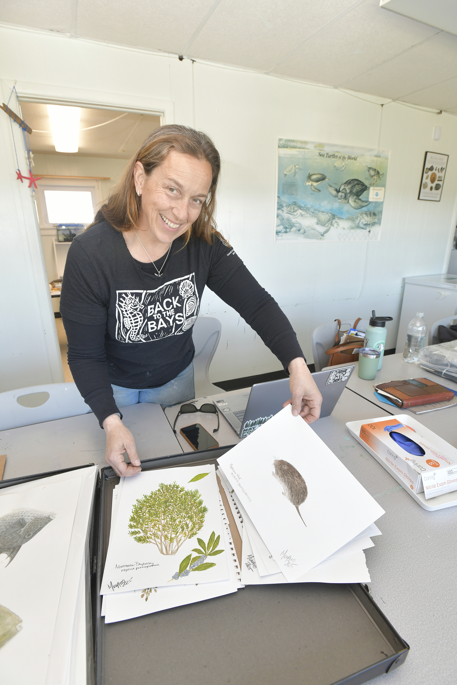 Carolyn Munaco with some of her artwork.  DANA SHAW