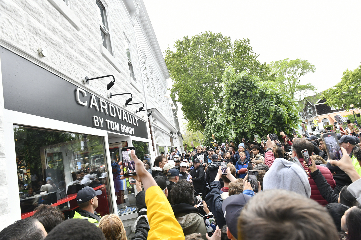 The crowd swarms CardVault by Tom Brady on Newtown Lane in East Hampton on May 22.  DANA SHAW