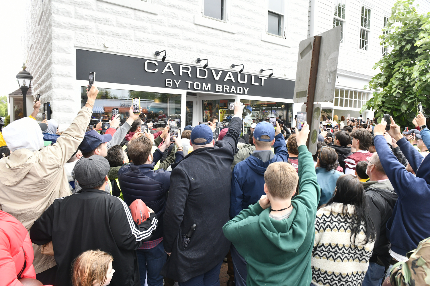 The crowd swarms CardVault by Tom Brady on Newtown Lane in East Hampton on May 22.  DANA SHAW