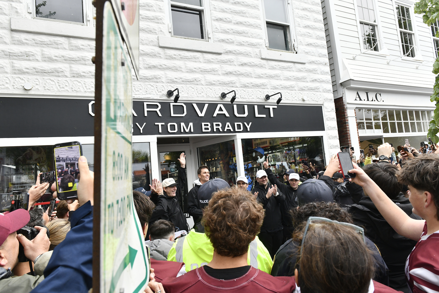 The crowd swarms CardVault by Tom Brady on Newtown Lane in East Hampton on May 22.  DANA SHAW
