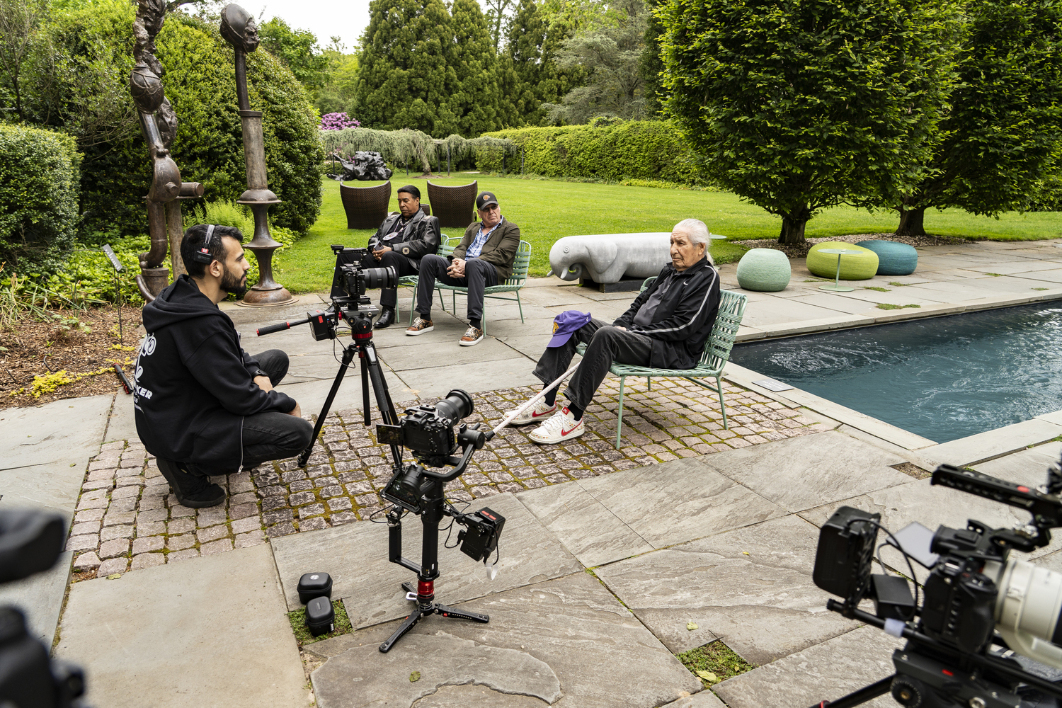 Chief Oren Lyons, at right, and his son Rex, second from right, visited the Long House Reserve in East Hampton while on the South Fork, where he met with Shinnecock Lance Gumbs, second from left.  VISION MAKER PRODUCTIONS